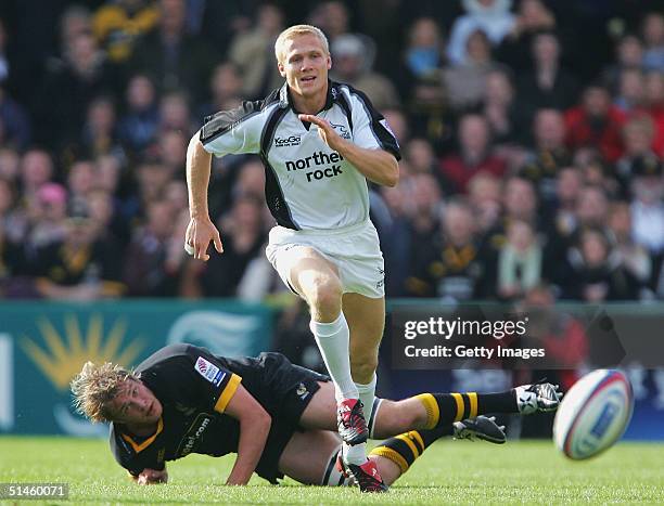 Michael Stephenson of Newcastle Falcons breaks away from John Hart of Wasps during the Zurich Premiership match between London Wasps and Newcastle...