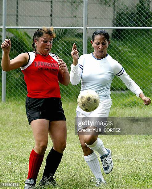 Guatemalan footballer Vilma , member of the female soccer team "Estrellas de la Linea" , constituted by prostitutes, vies for the ball with...