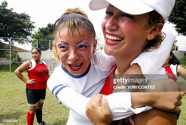 Guatemalan footballer Valeria of the female soccer team "Estrellas de la Linea" , constituted by prostitutes, hugs Salvadorean player Maribel, of...