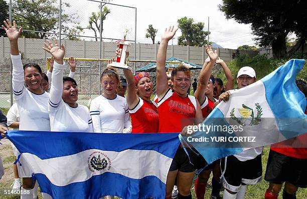 Guatemalan footballers of the female soccer team "Estrellas de la Linea" , constituted by prostitutes, celebrate with Salvadorean players of...