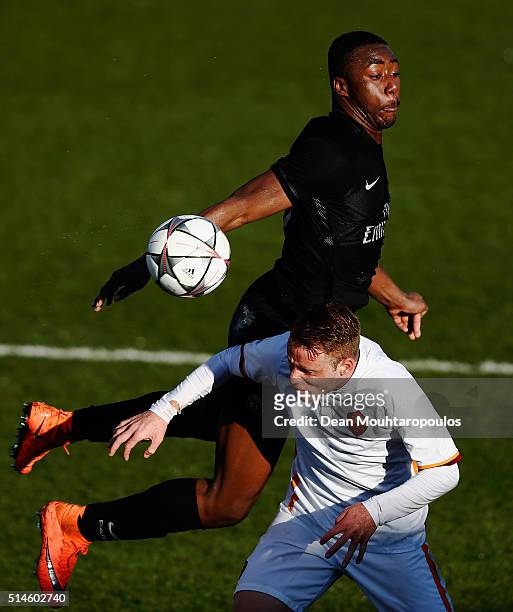 Odsonne Edouard of PSG battles for the ball with Lorenzo Grossi of Roma during the UEFA Youth League Quarter-final match between Paris Saint Germain...
