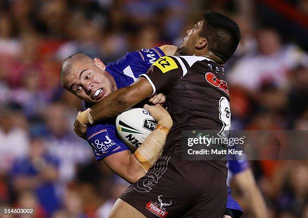 David Klemmer of the Bulldogs is tackled during the round two NRL match between the Penrith Panthers and the Canterbury Bulldogs at Pepper Stadium on...