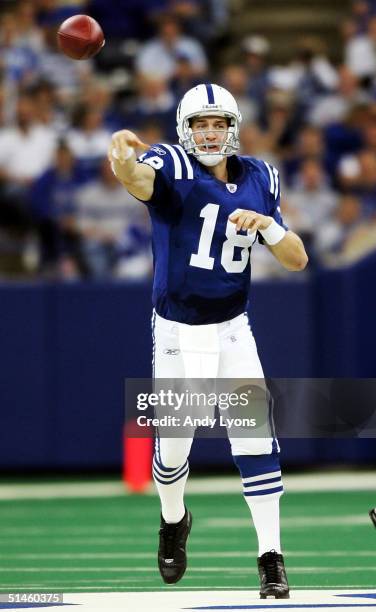 Peyton Manning of the Indianapolis Colts throws a pass against the Oakland Raiders during the game at the RCA Dome on October 10, 2004 in...