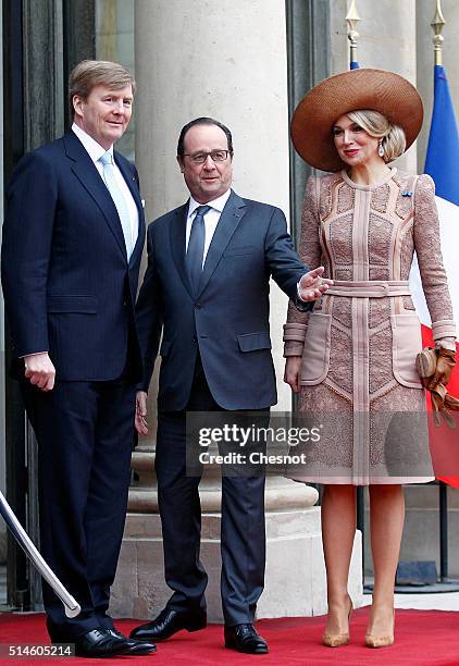 French President Francois Hollande welcomes Queen Maxima of the Netherlands and King Willem-Alexander of the Netherlands prior to attend a meeting at...