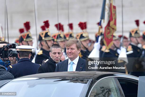 King Willem-Alexander of the Netherlands leaves the ceremony of the Unknown Soldier at the Arc de Triomphe on March 10, 2016 in Paris, France. Queen...