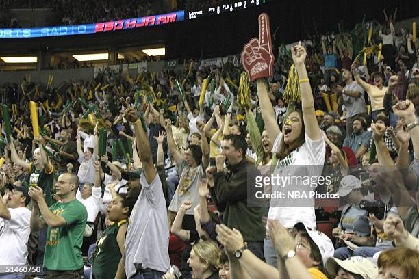 Fans show their support for the Seattle Storm at game two of 2004 WNBA Finals against Connecticut Sun at Key Arena October 10, 2004 in Seattle,...