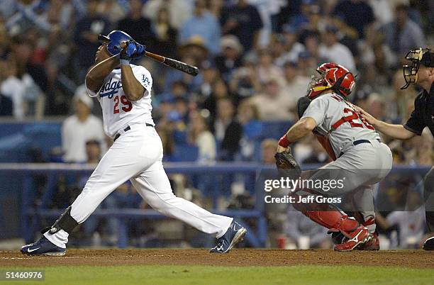 Adrian Beltre of the Los Angeles Dodgers hits a sacrifice fly that allowed Jayson Werth to score in the third inning of the National League Division...