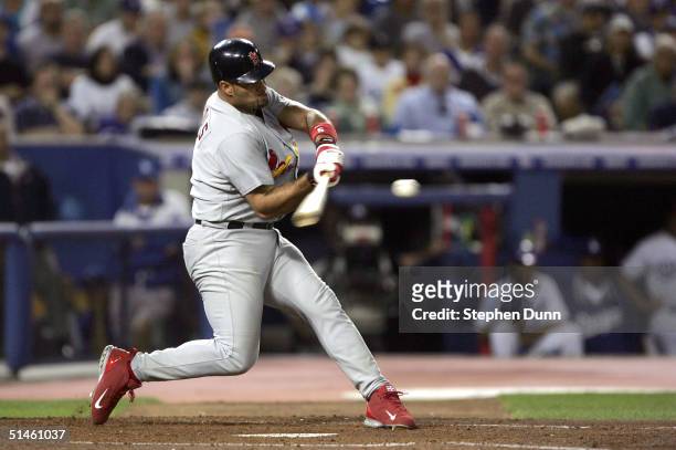 Albert Pujols of the St. Louis Cardinals hits a homerun, Tony Womack and Larry Walker scored 5-2 in the fourth inning over the Los Angeles Dodgers...