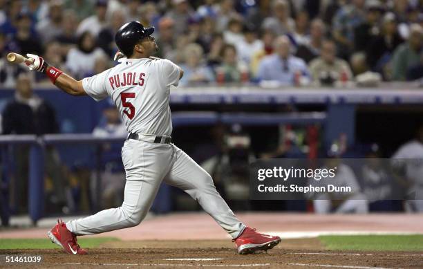 Albert Pujols of the St. Louis Cardinals hits a homerun, Tony Womack and Larry Walker scored 5-2 in the fourth inning over the Los Angeles Dodgers...