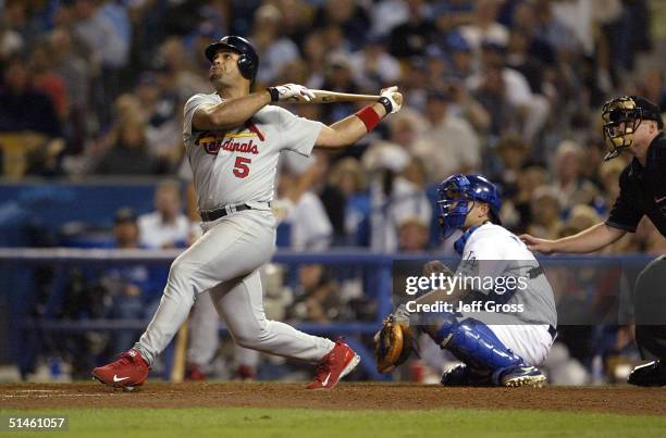 Albert Pujols of the St. Louis Cardinals hits a homerun, Tony Womack and Larry Walker scored 5-2 in the fourth inning over the Los Angeles Dodgers...