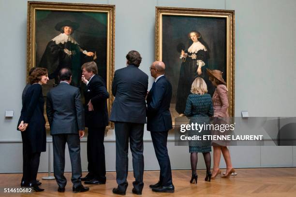 French President Francois Hollande , Netherlands' King Willem-Alexander and Queen Maxima look at two full-length wedding portraits of Amsterdam...