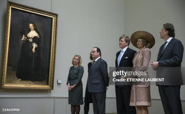 French President Francois Hollande , Netherlands' King Willem-Alexander and Queen Maxima look at the portrait of Oopjen Coppit, one of two...