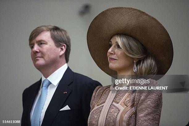 Netherlands' King Willem-Alexander and Queen Maxima look at the two new Rembrandt's paintings during their visit of the Louvre Museum in Paris, on...
