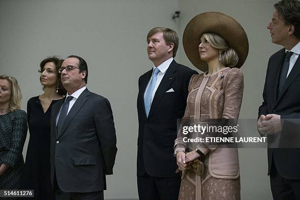 French President Francois Hollande , Netherlands' King Willem-Alexander and Queen Maxima listen to President-Director of the Louvre Jean-Luc...