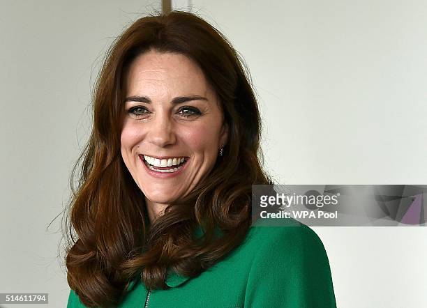 Catherine, Duchess of Cambridge smiles during her visit to St Thomas' Hospital with Prince William, Duke of Cambridge on March 10, 2016 in London,...