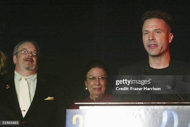 Neal Sopata accepts the award for Best Animation as presenters Joe Alaskey and Shelley Morrison look on at the 2004 ARPA International Film Festival...