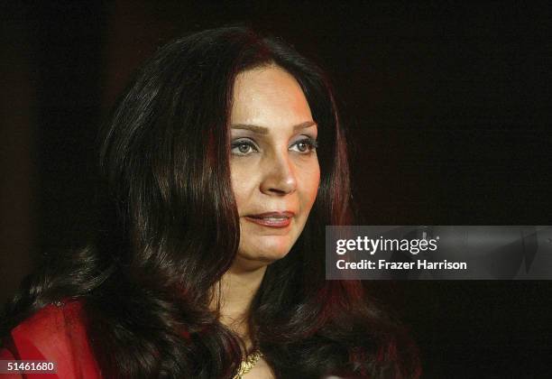 Maryan Milani accepts the award for Best Director on behalf of her sister, Tahmineh Milani, at the 2004 ARPA International Film Festival Gala and...