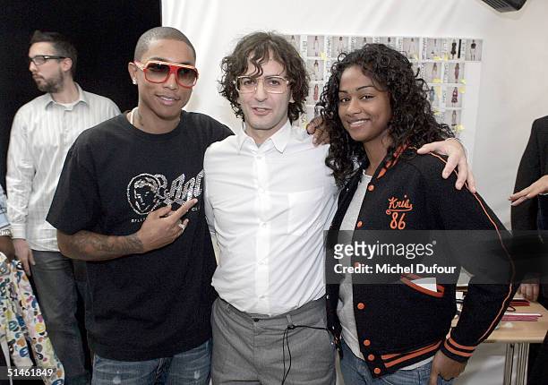 Music producer Pharrell Williams and guest pose with designer Marc Jacobs backstage at the Louis Vuitton fashion show as part of Paris Fashion Week...