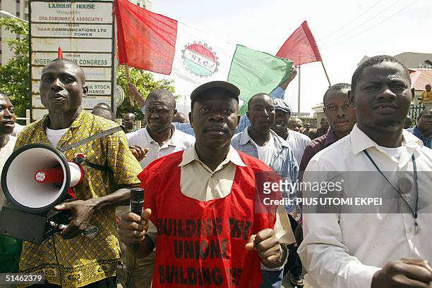 The President of the Nigeria Labour Congress Adams Oshiomhole leads a procession of workers 11 October 2004 during a protest rally by the congress in...