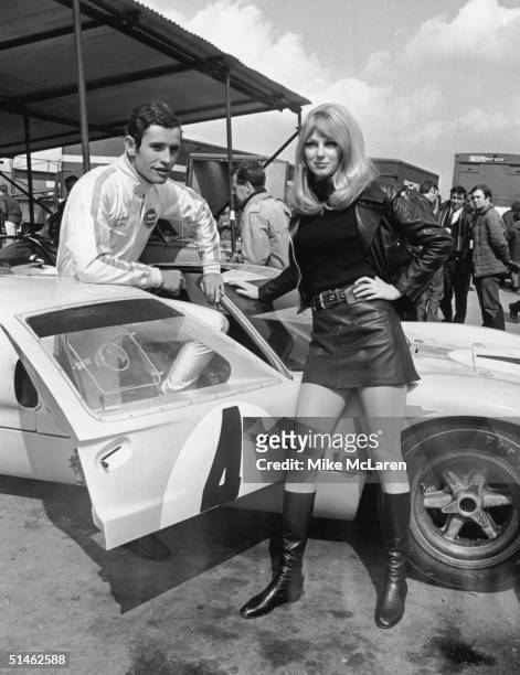 Belgian racing driver Jacky Ickx at Brands Hatch with his Ford GT40 and girlfriend Peta Selcombe during practice sessions for the B.O.A.C....