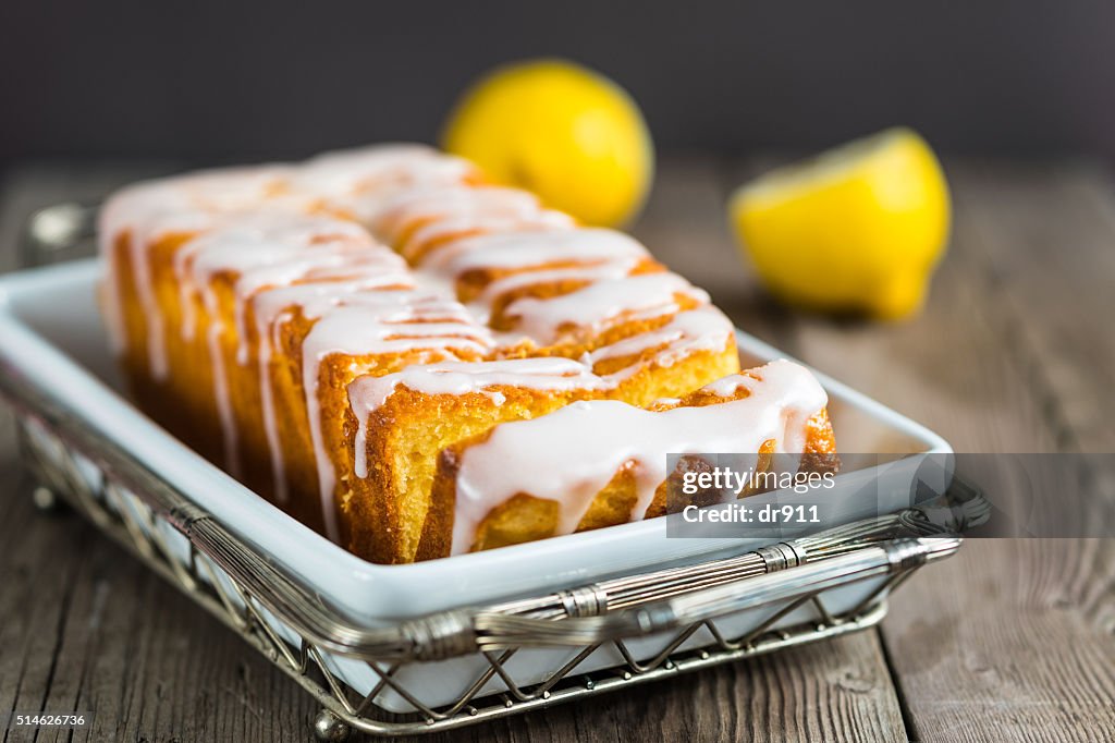 Lemon yogurt loaf cake, sliced on plate