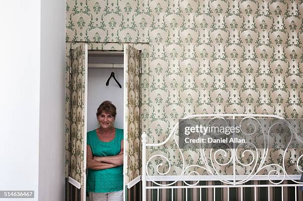 woman in cupboard - woman hiding in closet stock pictures, royalty-free photos & images
