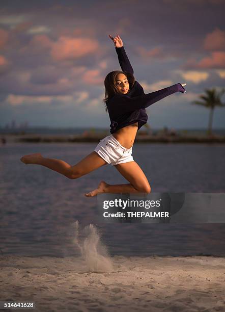 teenager jumping in the beach - ballet girl stock pictures, royalty-free photos & images