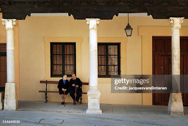 old couple sitting on a bench - museum bench stock pictures, royalty-free photos & images