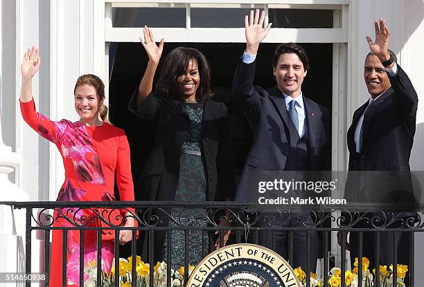 President Barack Obama and Canadian Prime Minister Justin Trudeau , U.S. First lady Michelle Obama and Sophie Grégoire-Trudeau wave to invited guests...