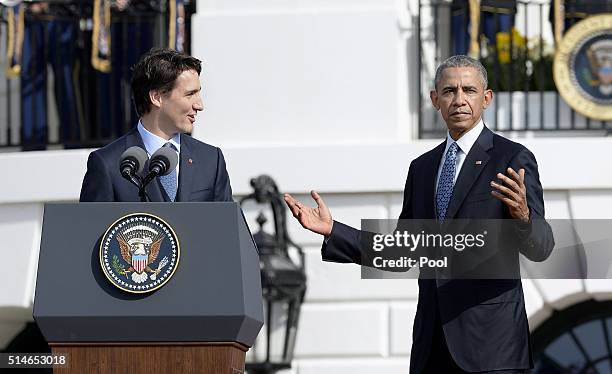 Canadian Prime Minister Justin Trudeau speaks as President Barack Obama gestures during a welcoming ceremony to the White House for an Official Visit...