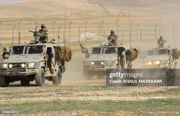 Jordanian special forces show their skills during a military demonstration at a Joint Training Center outside the city of Zarqa, northeast of the...