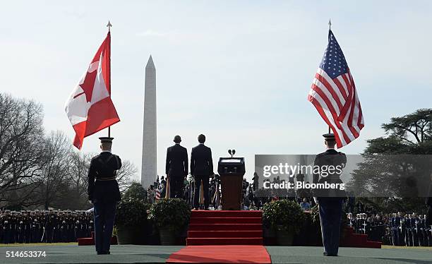 President Barack Obama, center left, stands with Justin Trudeau, Canada's prime minister, center, during a welcoming ceremony on the South Lawn of...