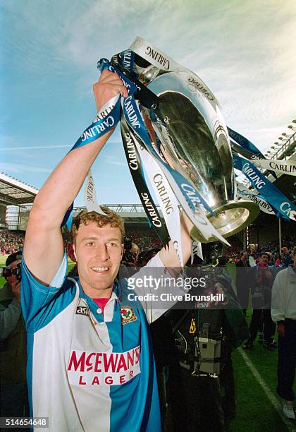 Chris Sutton of Blackburn Rovers celebrateS with the Premiership trophy after winning the 1994/95 FA Carling Premiership title after the match...