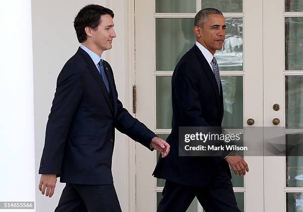 President Barack Obama and Canadian Prime Minister Justin Trudeau walk from the Oval Office to a joint press conference in the Rose Garden at the...