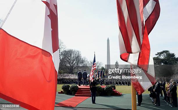 President Barack Obama, center left, stands with Justin Trudeau, Canada's prime minister, center, during a welcoming ceremony on the South Lawn of...