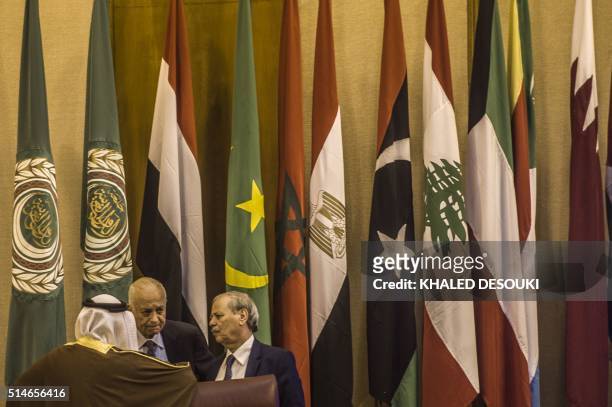 The Arab League Secretary General Nabil al-Arabi and his deputy Ahmed bin Helli speak at the main hall of the Arab League headquarters before a...