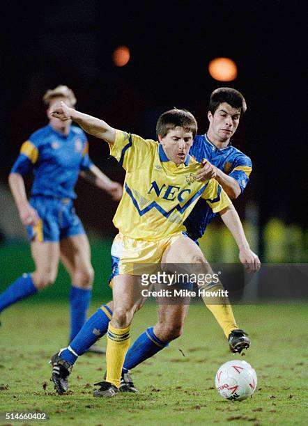 Peter Beardsley of Everton holds off a challenge during a League Division One match between Wimbledon and Everton on March 10, 1992 in London,...