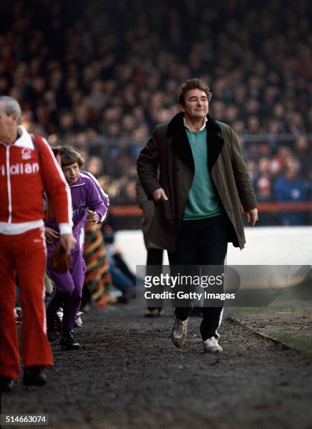Nottingham Forest manager Brian Clough walks down the touchline to take his place in the dugout at the City ground before a match during the 1979/80...