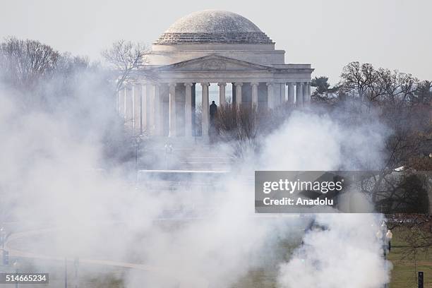 Smoke from ceremonial cannons rise in front of the Jefferson Memorial as President Barack Obama welcomes Canadian Prime Minister Justin Trudeau to...