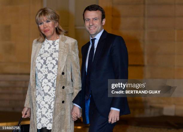 French Economy Minister Emmanuel Macron and his wife Brigitte Trogneux arrive for a state dinner in honor of King Willem and Queen Maxima of The...