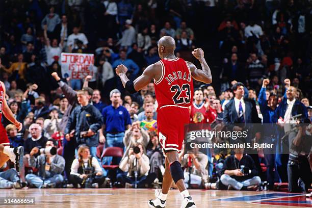 Michael Jordan of the Chicago Bulls celebrates against the Philadelphia 76ers on March 18, 1996 at the Spectrum in Philadelphia, Pennsylvania. NOTE...