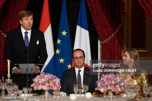 King Willem of The Netherlands delivers a speech as Queen Maxima and French President Francois Hollande listen during a state dinner in honor of the...