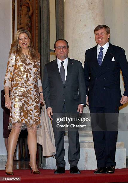 French President Francois Hollande welcomes Queen Maxima of the Netherlands and King Willem-Alexander of the Netherlands prior to attend a state...