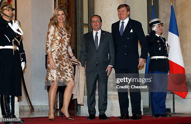 French President Francois Hollande welcomes Queen Maxima of the Netherlands and King Willem-Alexander of the Netherlands prior to attend a state...