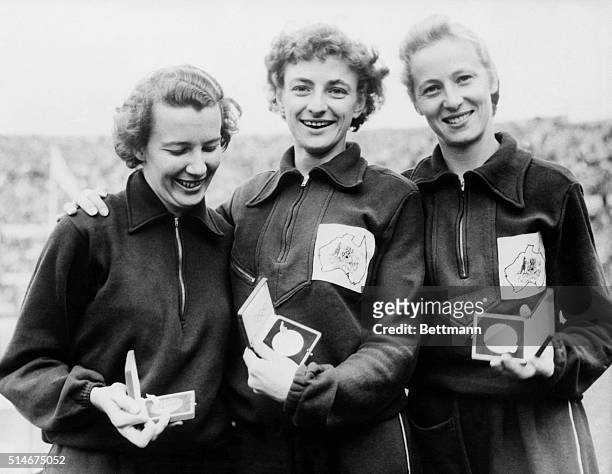Helsinki, Finland: Win women's 100 meter run. Holding the Olympic medals they won in the women's 100-meter dash of the Olympic games are Daphne...