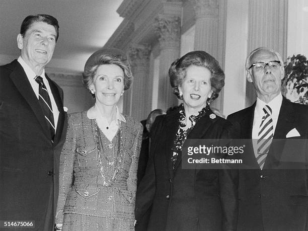 President Reagan and Nancy Reagan pose with Prime Minister Margaret Thatcher and her husband in London.