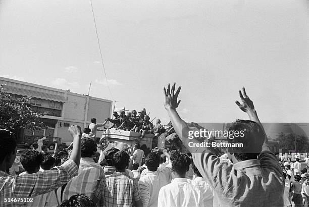 Residents of Dacca, East Pakistan cheer as Indian troops enter the city after the surrender of Pakistani forces. This ended the eastern war between...