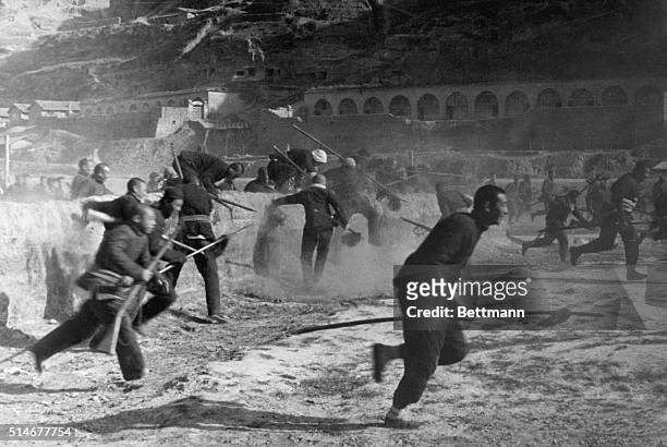 Yenan, China: BEFORE THEY FACE THE ALLIES: This is an authentic scene in Yenan of People's Guerilla Fighters in training. First Mao used them in his...