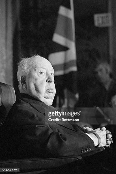 Alfred Hitchcock sits at a press conference in which British Consul General to Los Angeles, Thomas Aston, announced formally that Hitchcock has been...