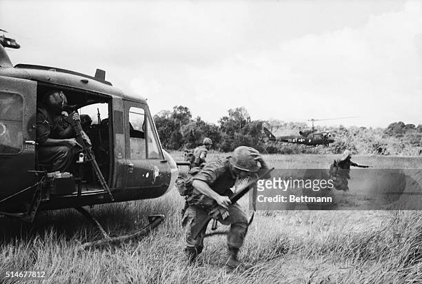 War Zone D, South Vietnam: United States paratroopers of the 173rd Airborne disembark from their helicopters as they join with Vietnamese and...